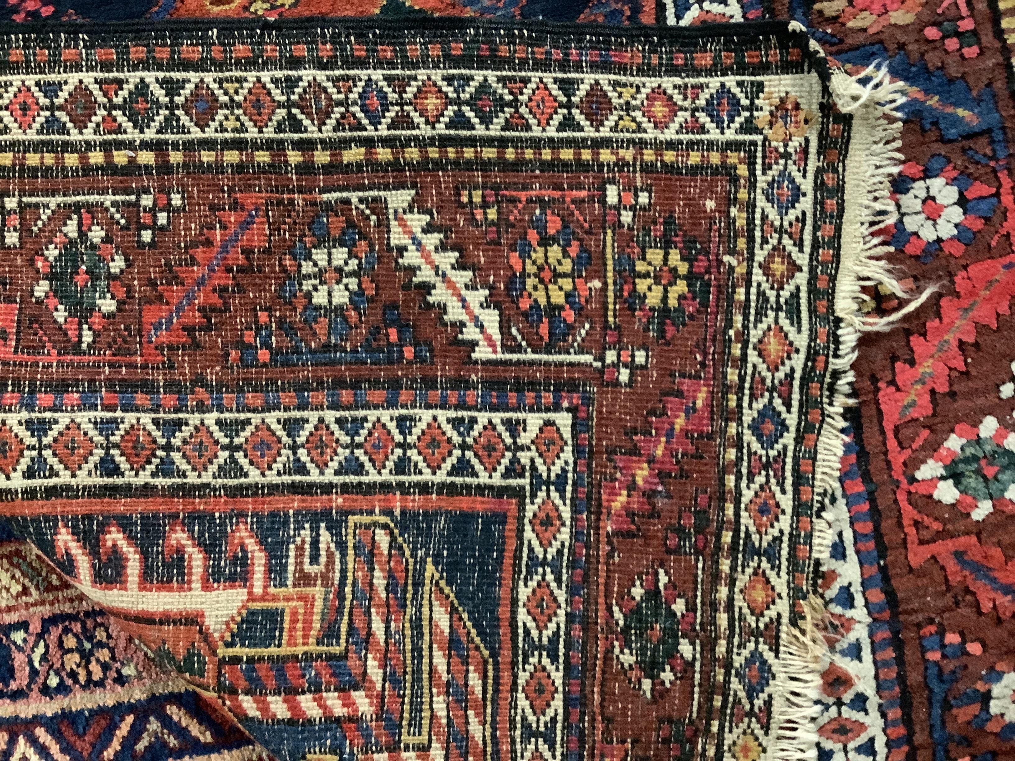 A Caucasian blue ground rug, 231 x 97cm